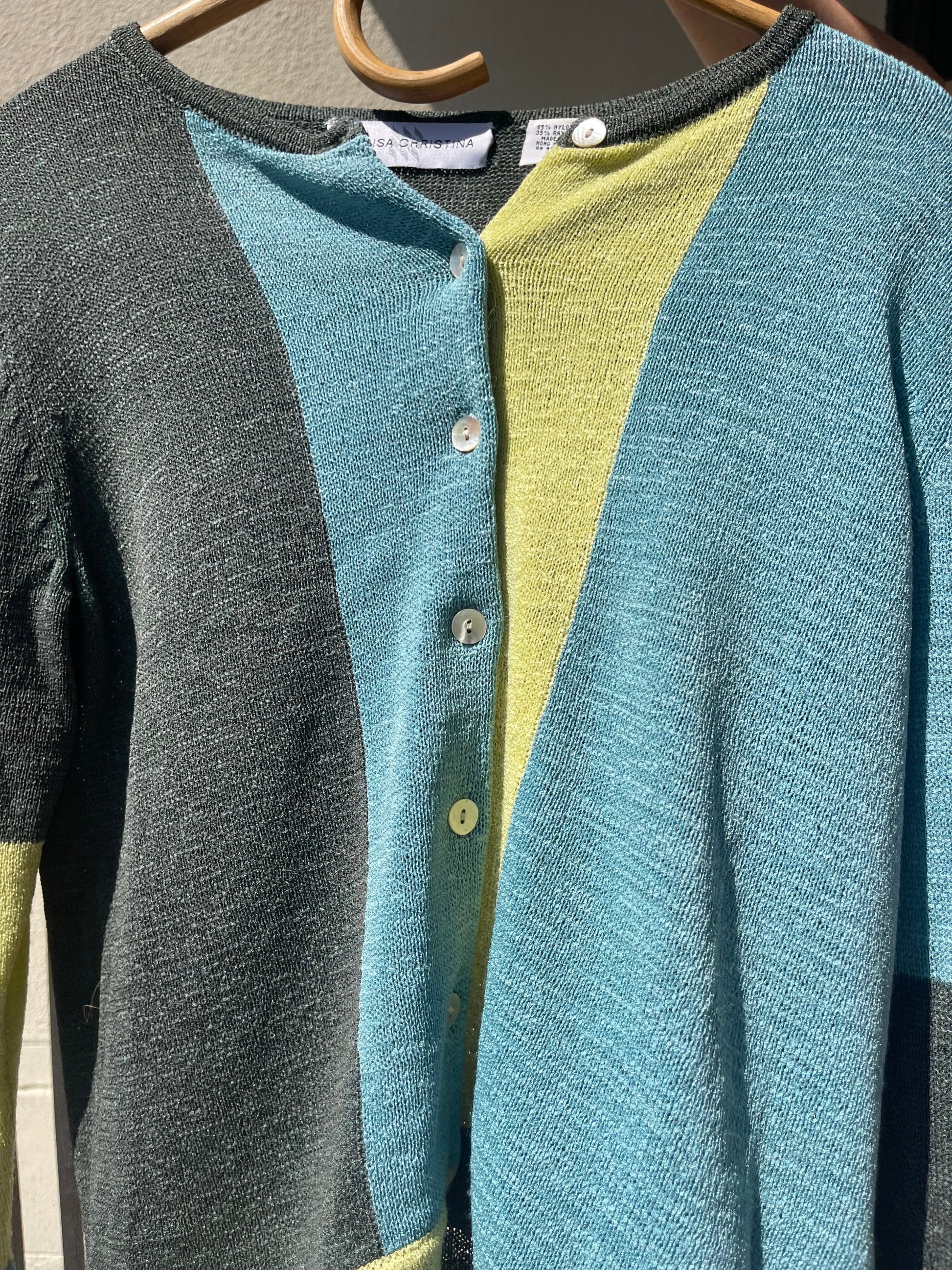 Vintage women's small color block cardigan close up