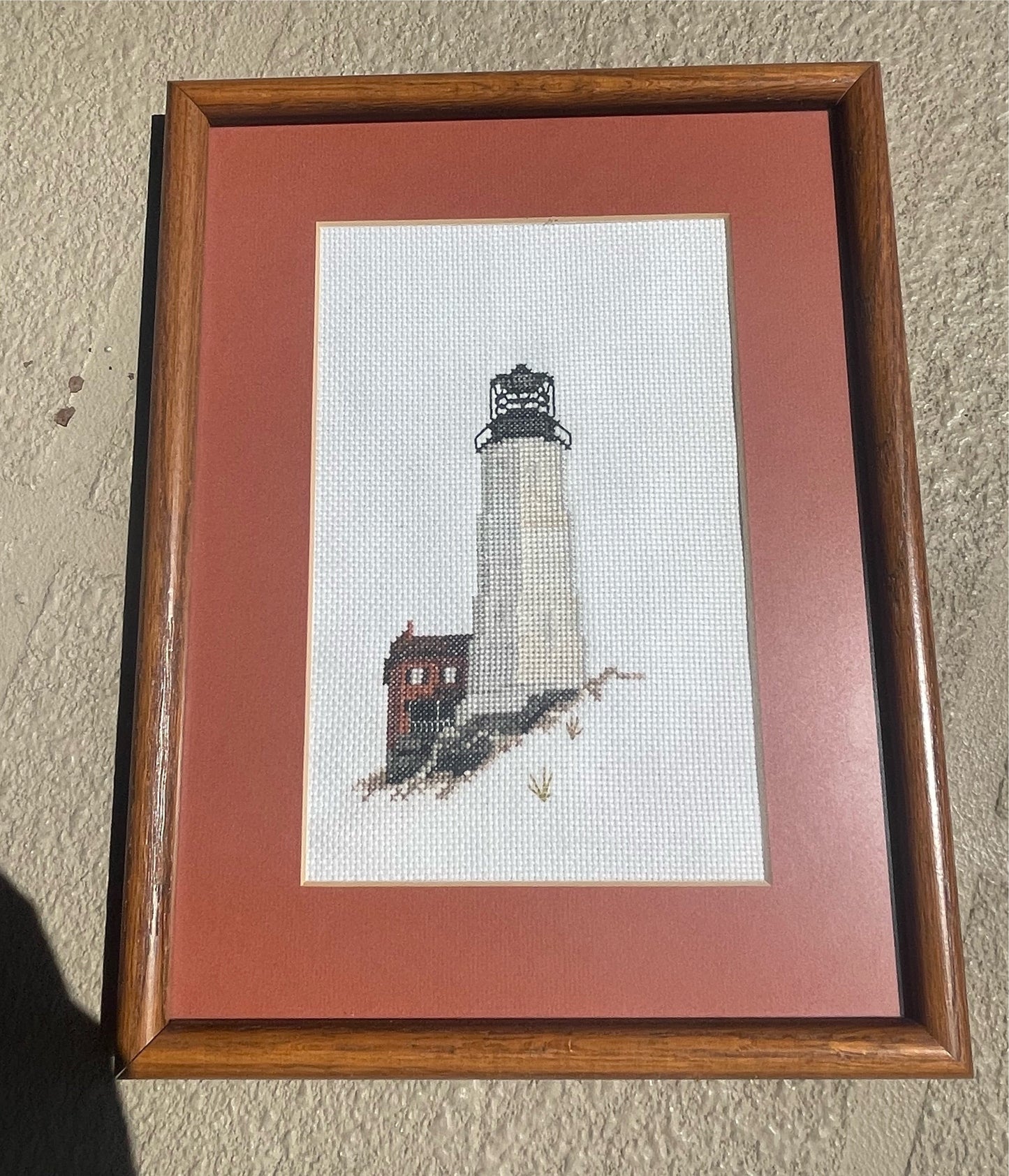 Vintage needle point of a lighthouse